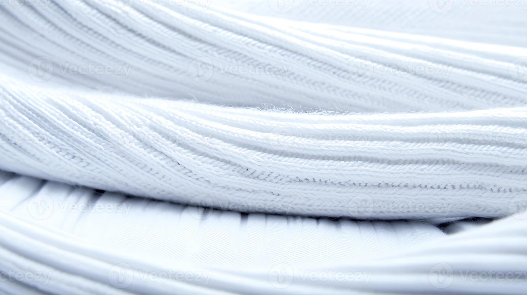 Close-up view of soft white fabric layers showcasing texture and smoothness, ideal for fashion design photo