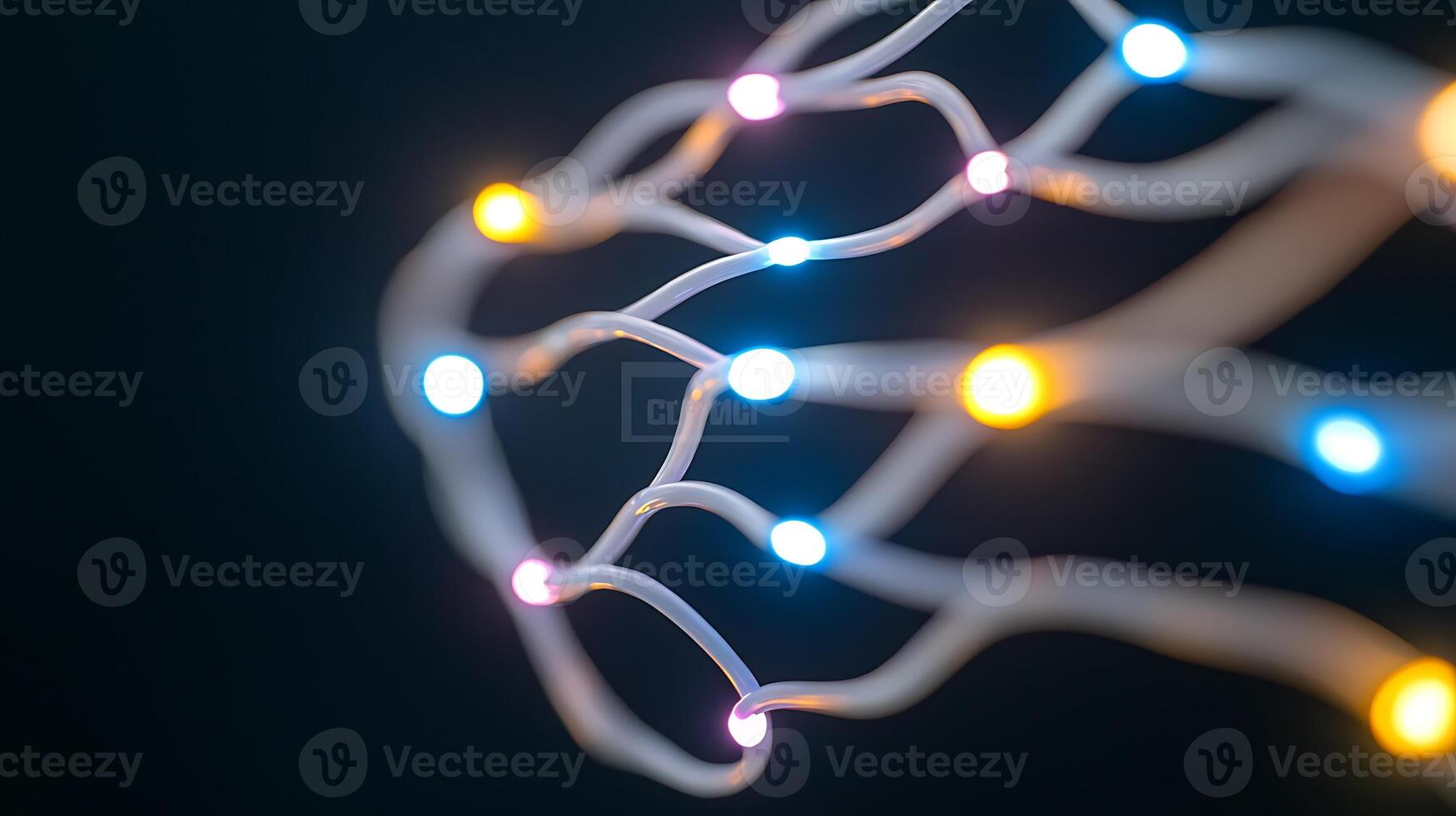 Abstract close-up of colorful glowing wires intertwined against a dark background, showcasing illumination photo