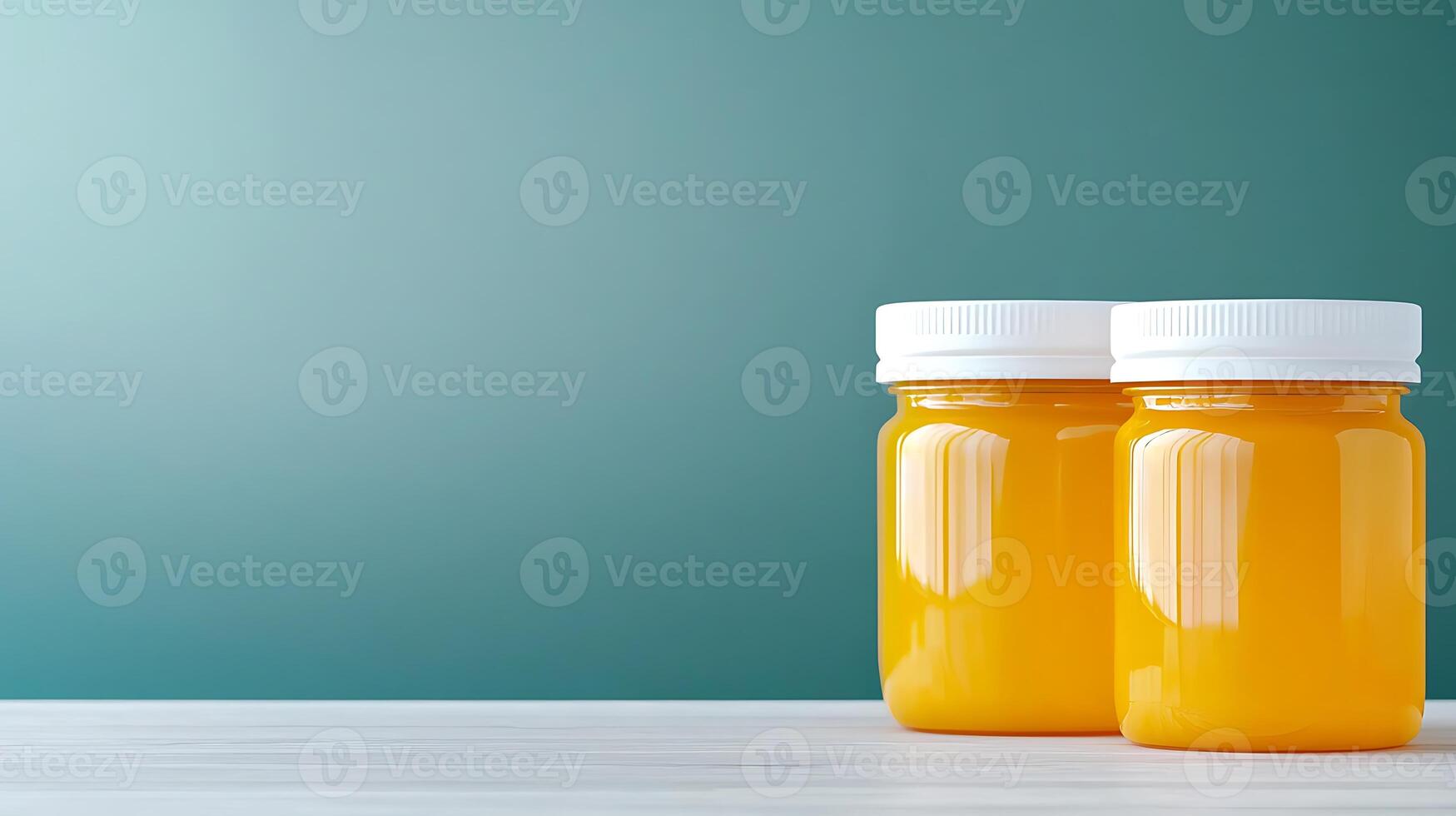 Two jars of bright orange juice sit on a wooden table against a soft gradient background photo