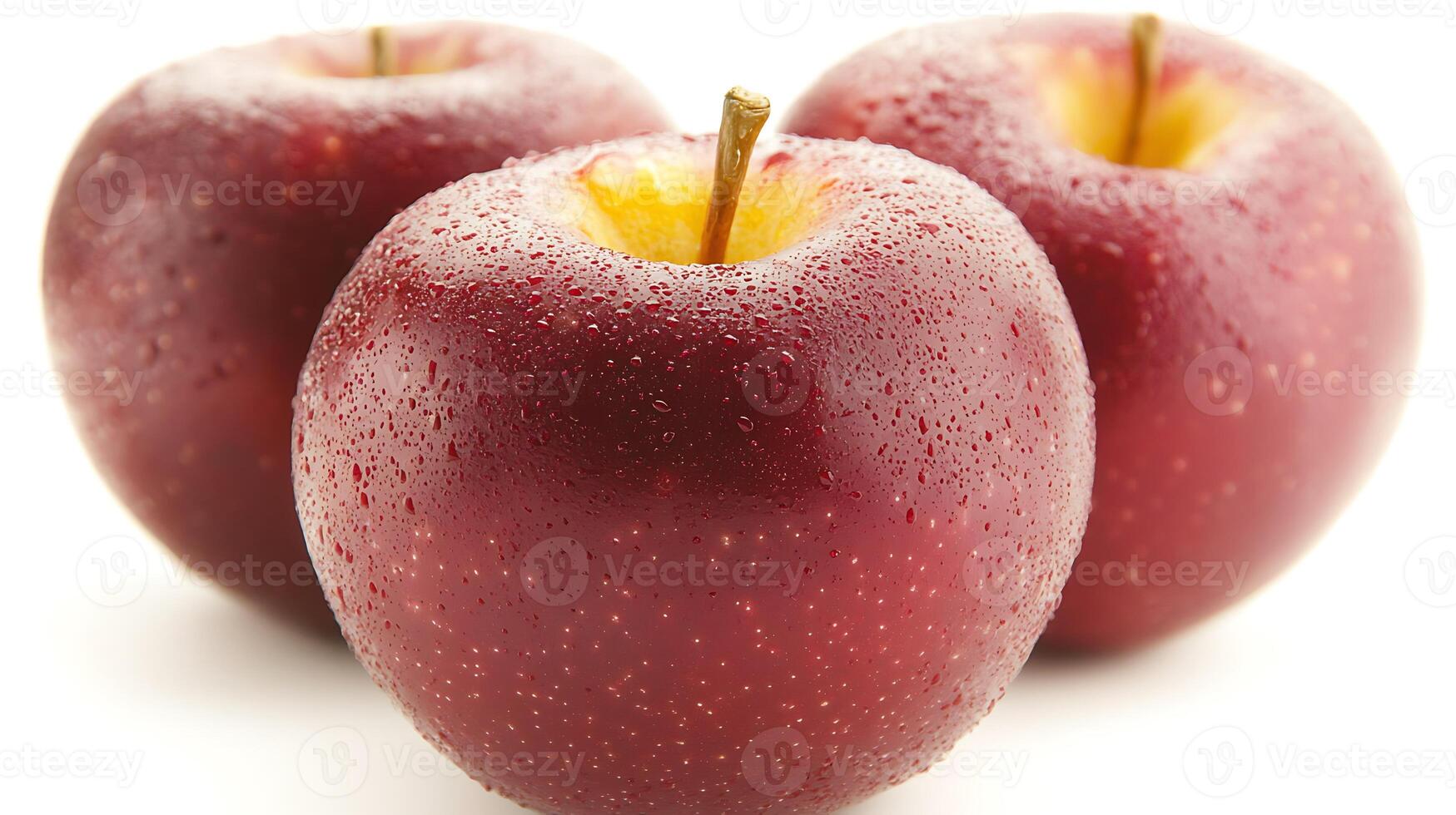 Three fresh red apples with droplets of water on them, showcasing their vibrant color and texture photo