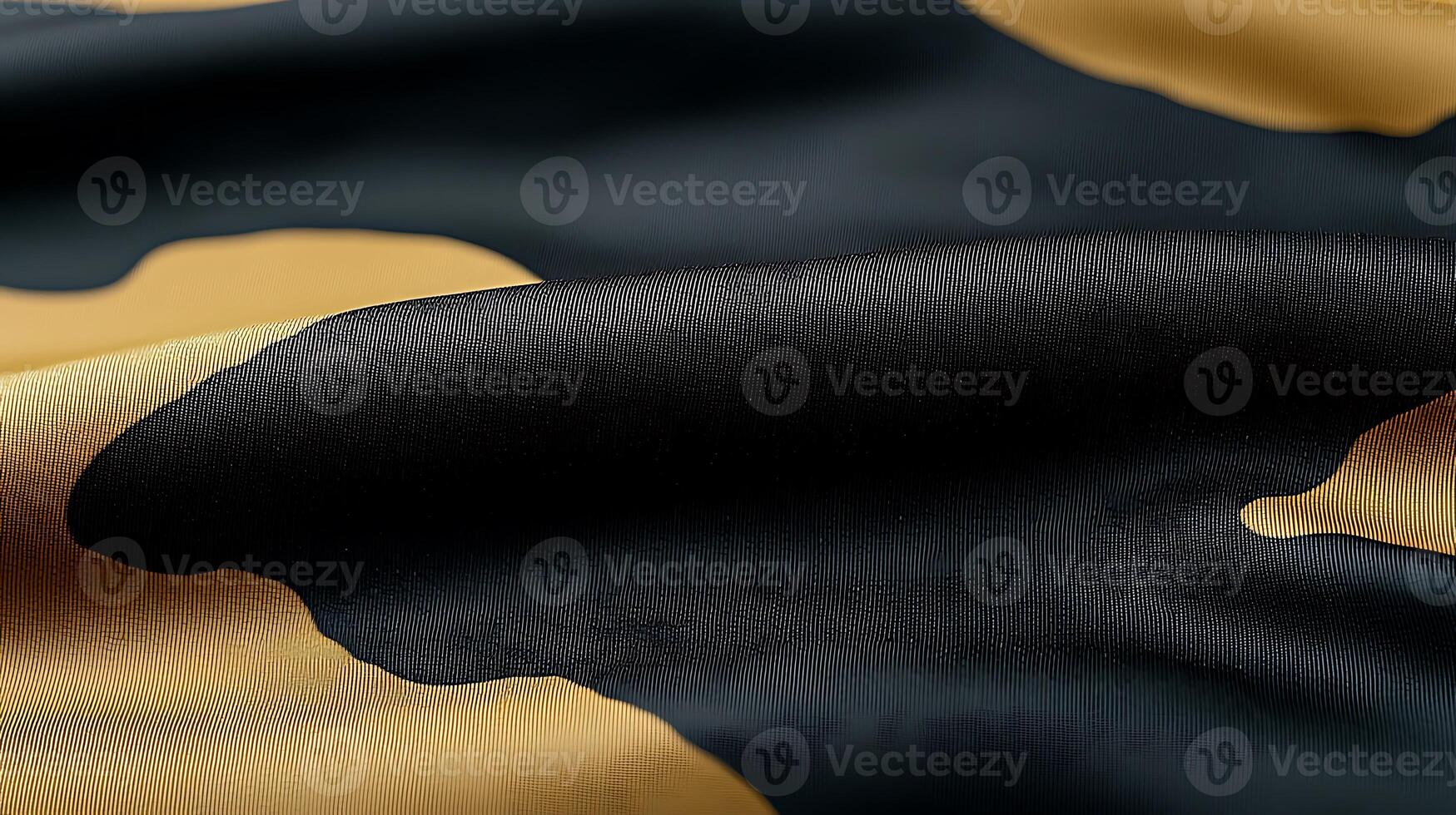 Close-up view of a textured fabric with black and gold patterns, showcasing rich colors and smoothness photo