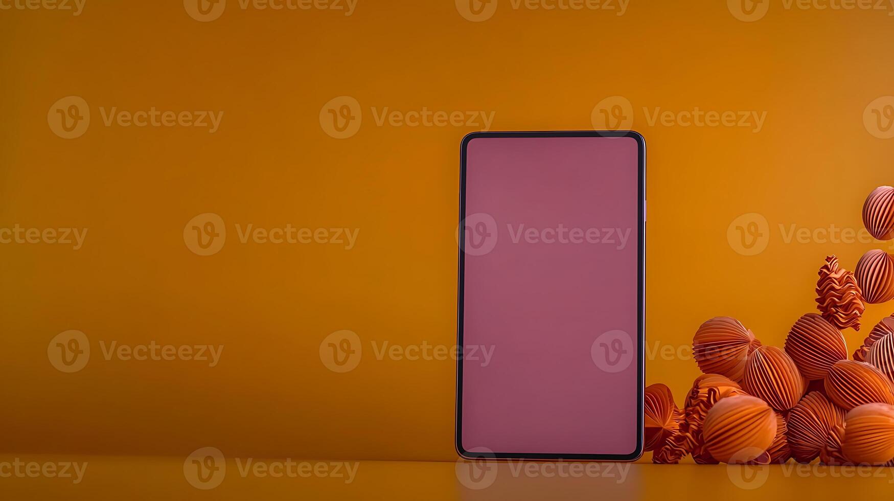 A minimalist smartphone on a vibrant orange background surrounded by textured decorative balls photo