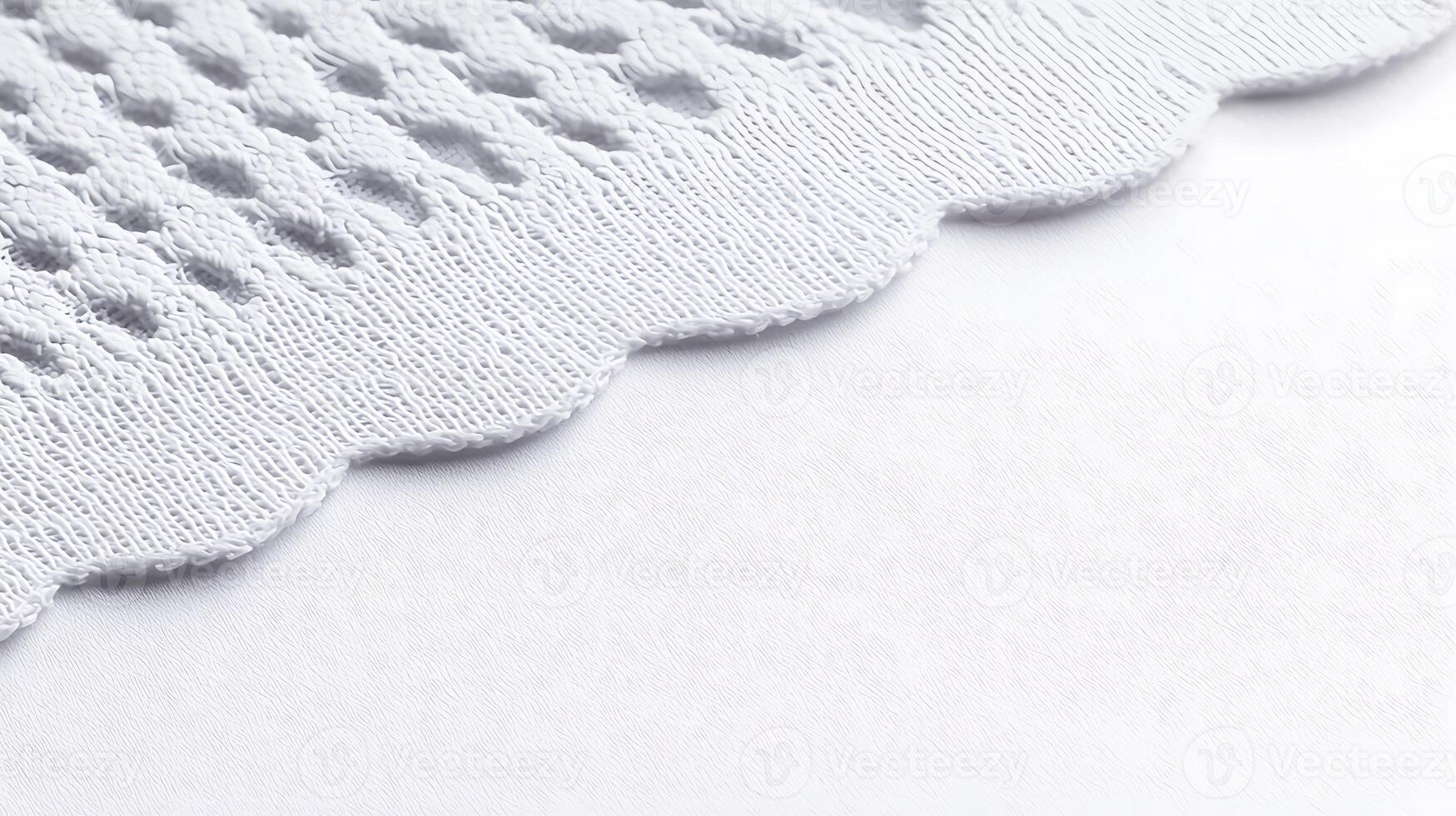 Close-up view of textured white fabric with scalloped edges, highlighting intricate patterns photo