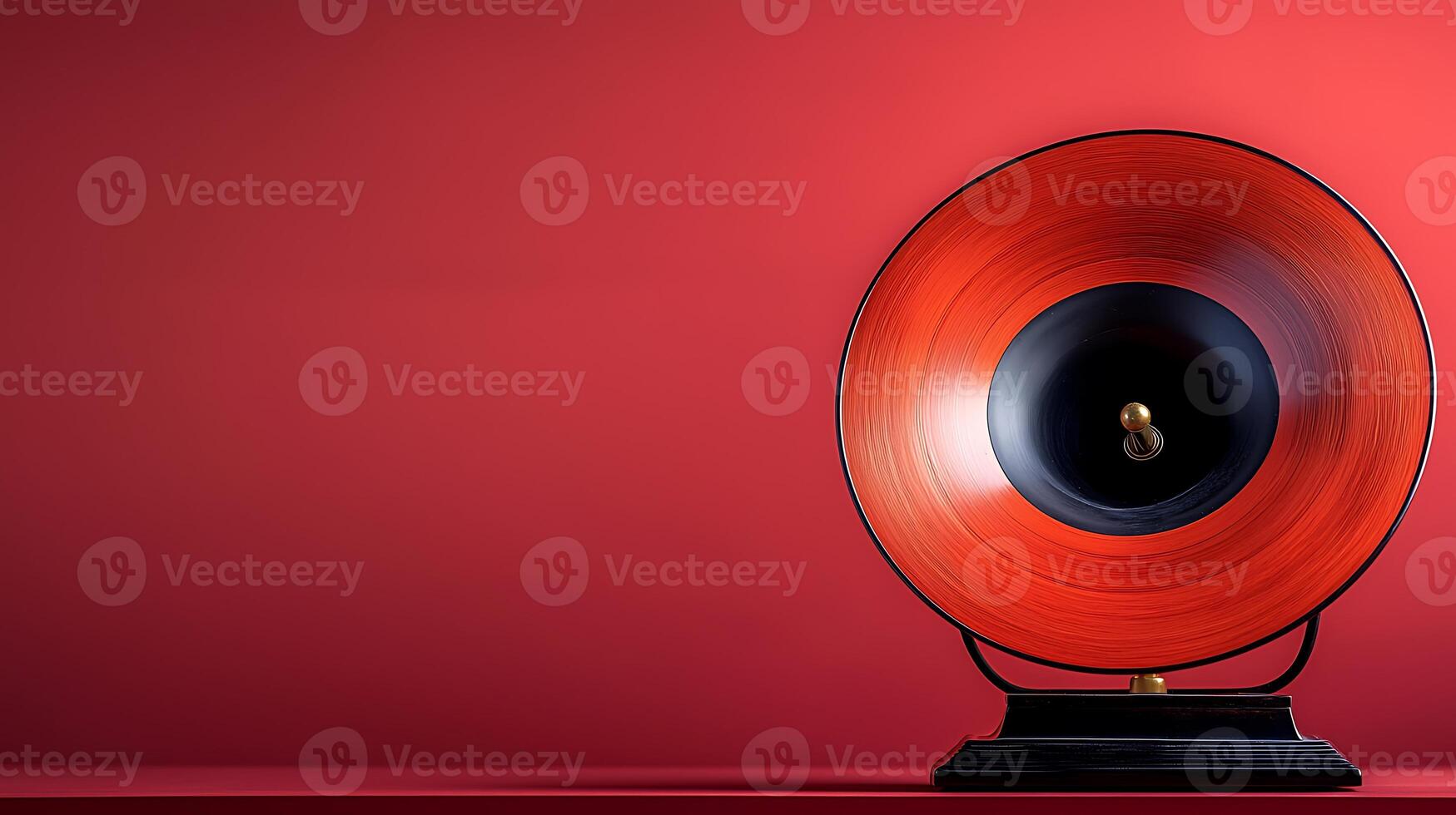 Vintage red gramophone on a smooth red background, evoking nostalgia and classic music vibes photo