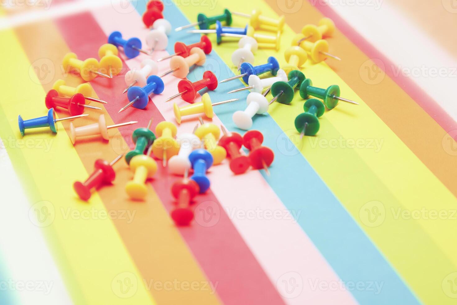 Colorful pushpins in one frame photo