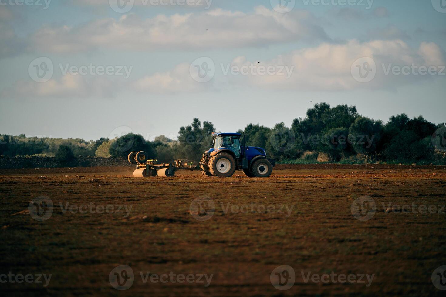 Tractor on field in countryside photo
