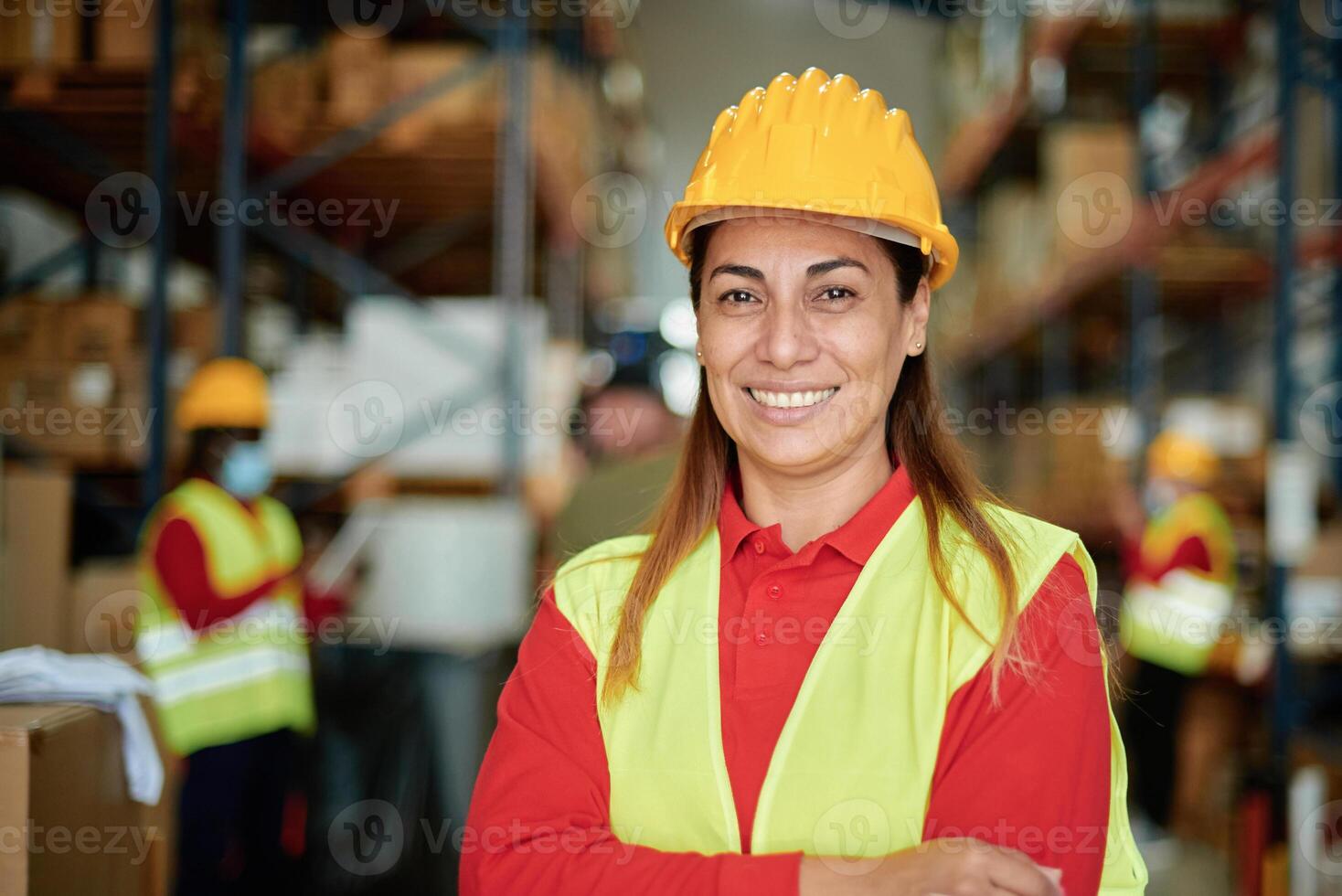 Confident Warehouse Worker Smiling in Industrial Environment photo