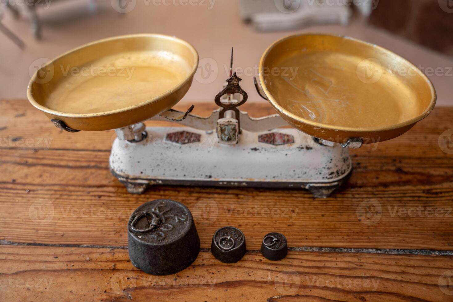 Weights and weighing scales on a bakery table photo