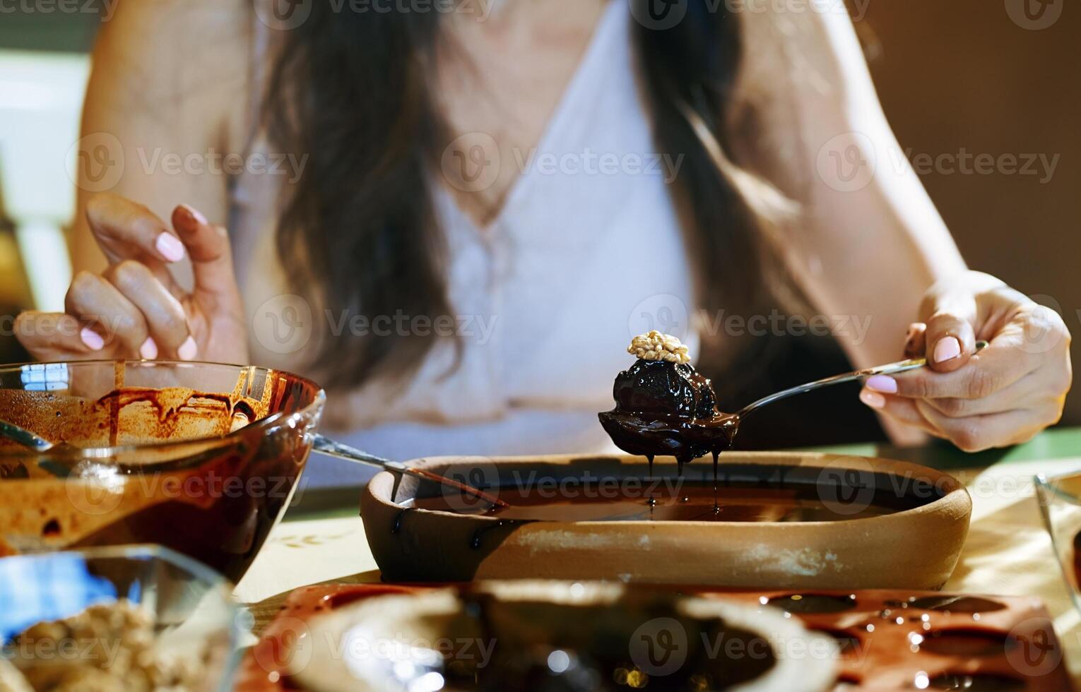 Staying at home woman preparing handmade chocolate dessert photo