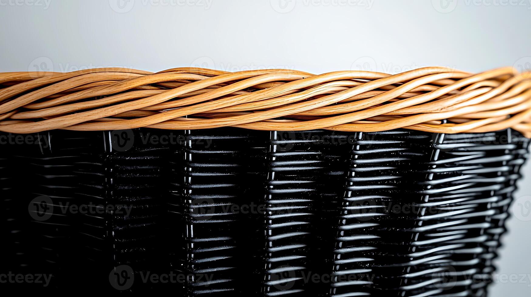 Close-up view of a woven basket showcasing intricate patterns and textures against a neutral background photo