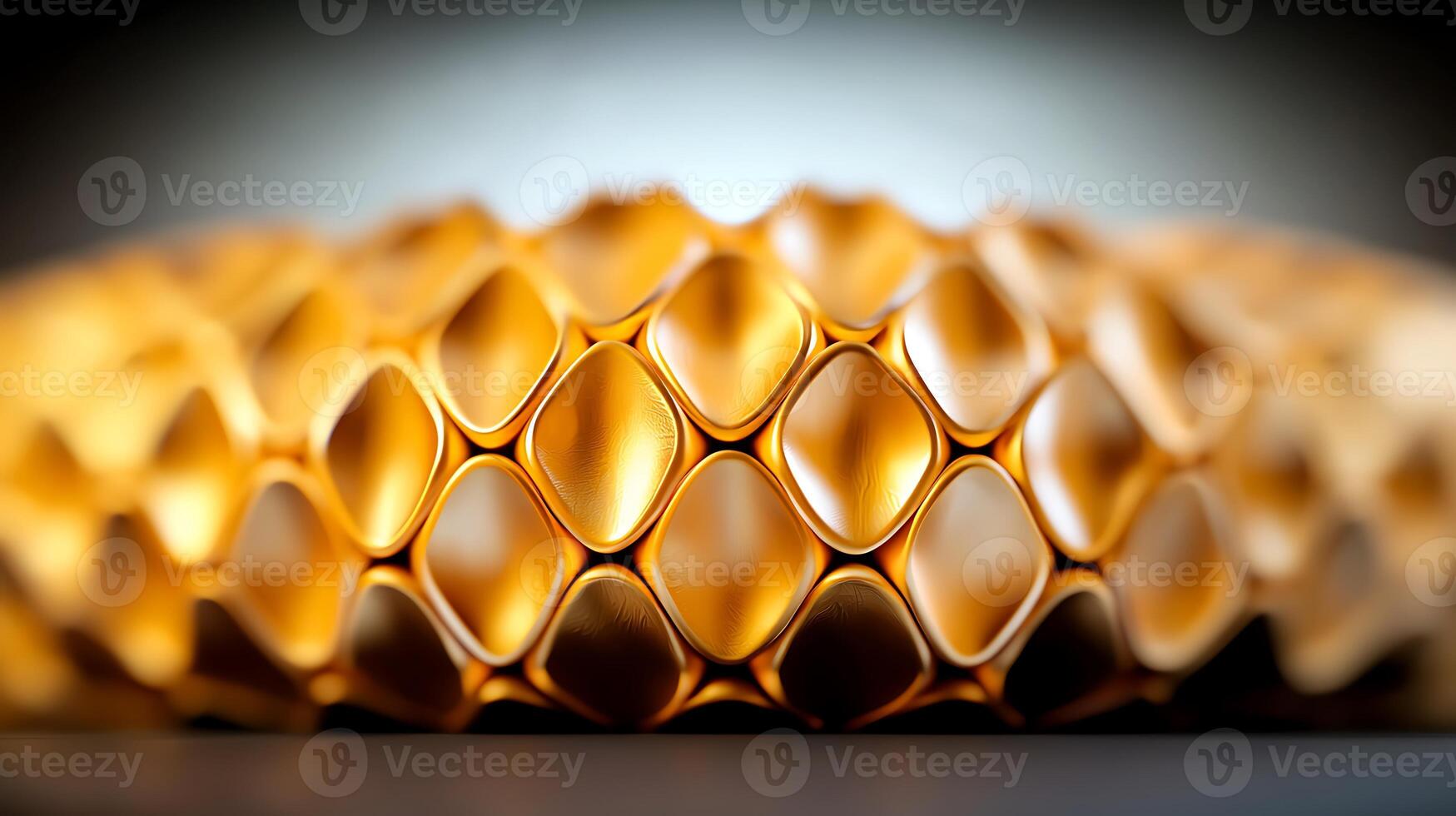 Close-up of a golden honeycomb structure showcasing intricate patterns and textures photo