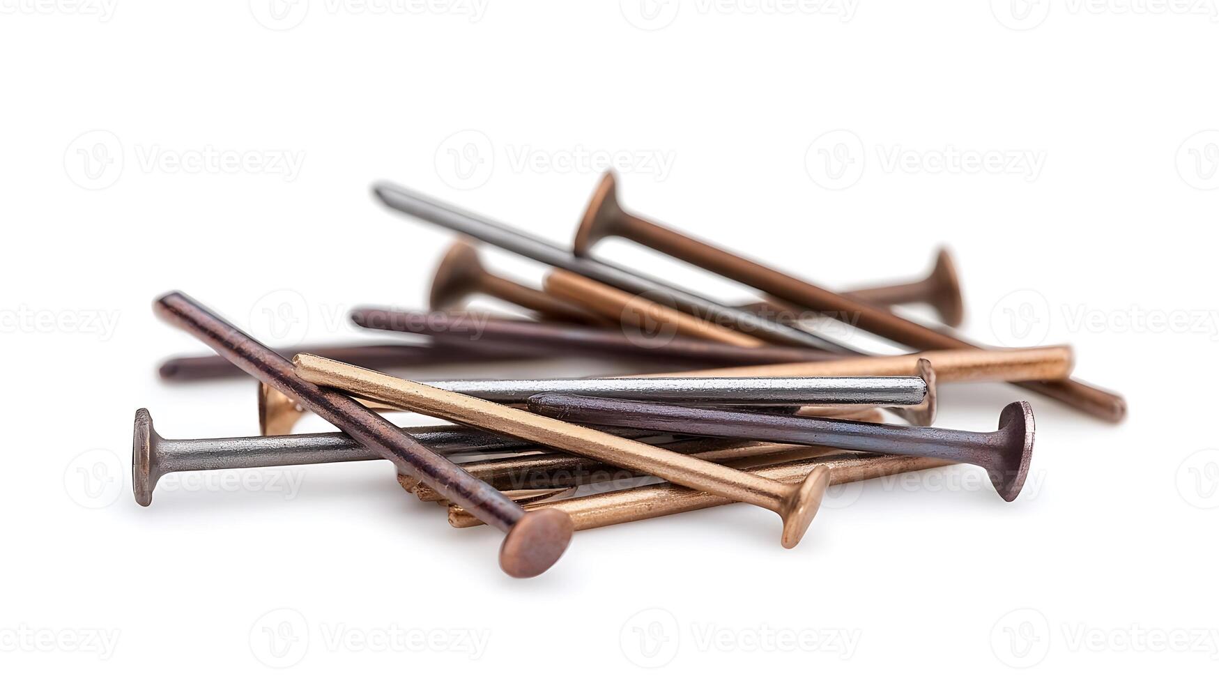 A close-up view of assorted metal nails scattered on a white background, showcasing their textures photo