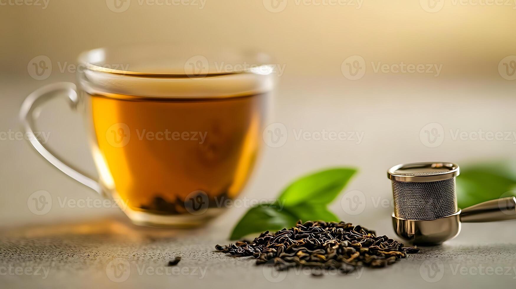 A close-up of a steaming cup of tea beside loose tea leaves and a tea infuser, with soft background photo