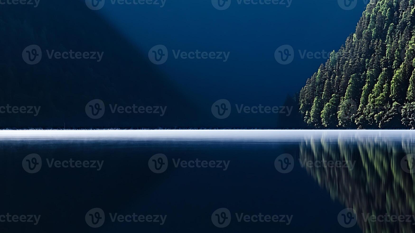 Serene twilight over a tranquil lake surrounded by dense evergreen forests reflecting in water photo