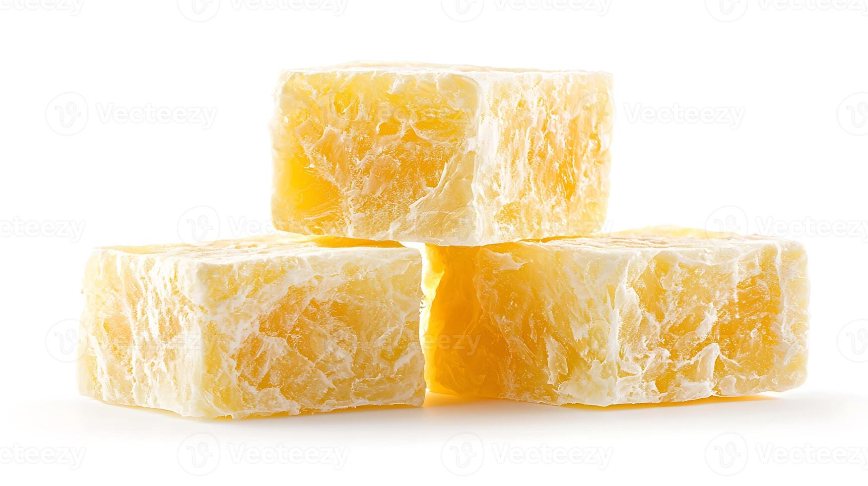 Close-up of three stacked yellow soap bars with a textured surface on a white background photo