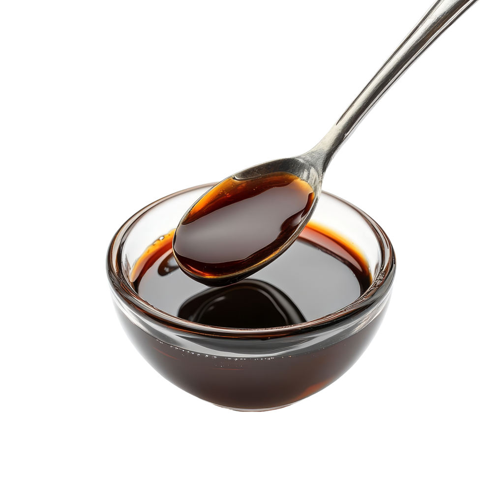 Malt extract in a glass bowl with a metal spoon on a transparent background showcasing its rich, dark color, malt extract on transparent background png