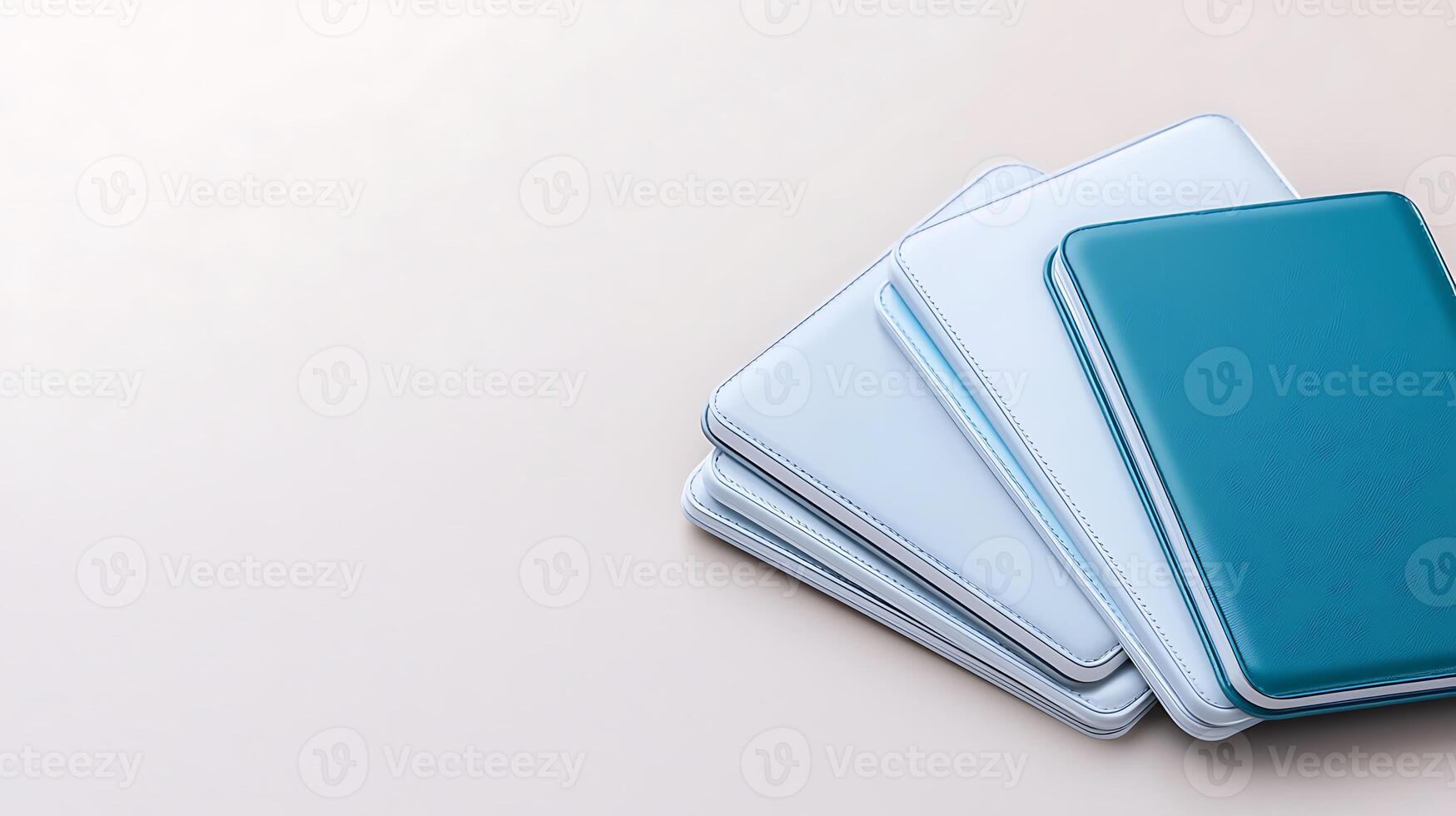 Stacked modern storage containers in varying shades of blue and white on a soft background photo