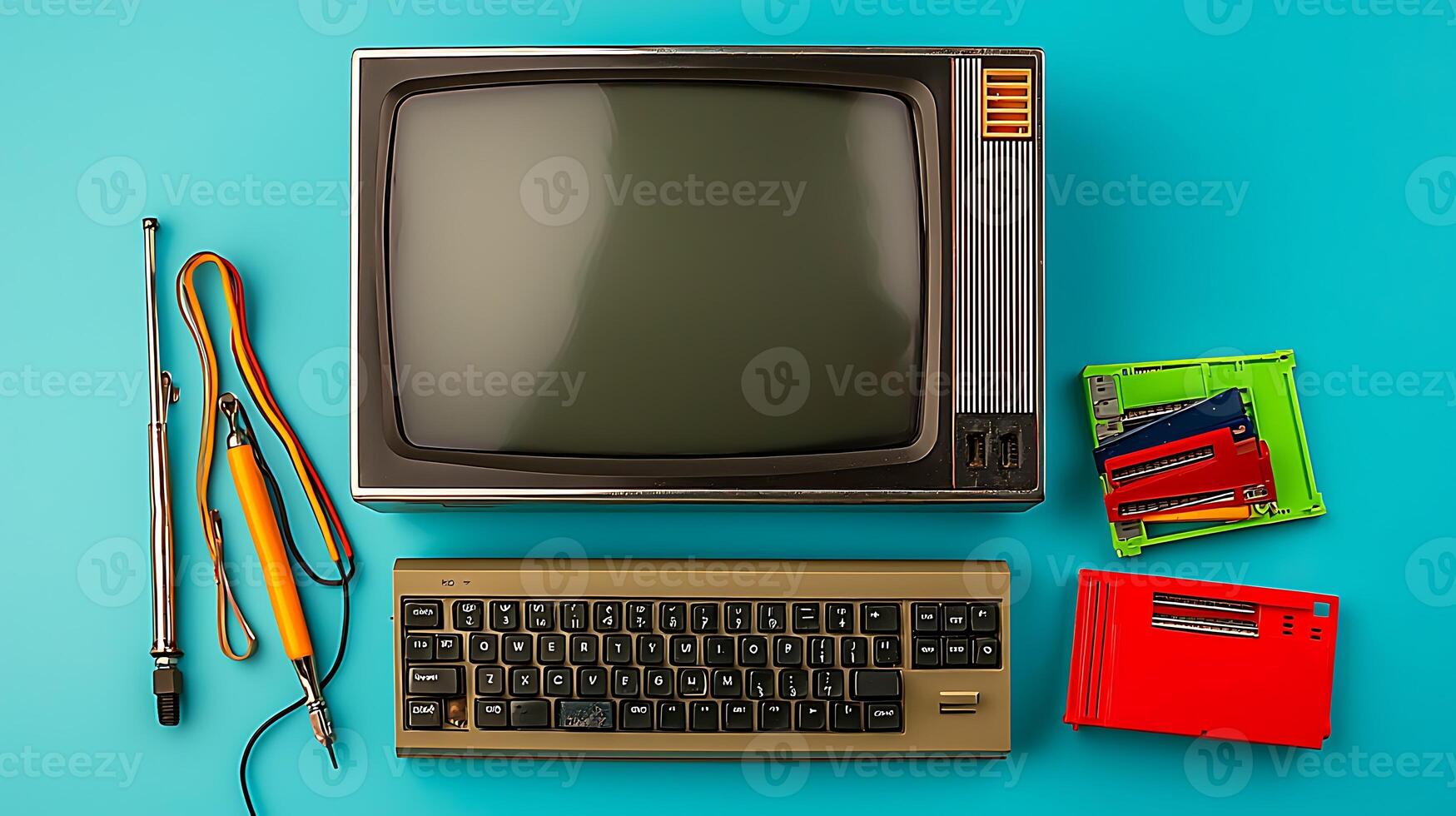 Vintage computer setup with monitor, keyboard, and tools on a bright teal background photo