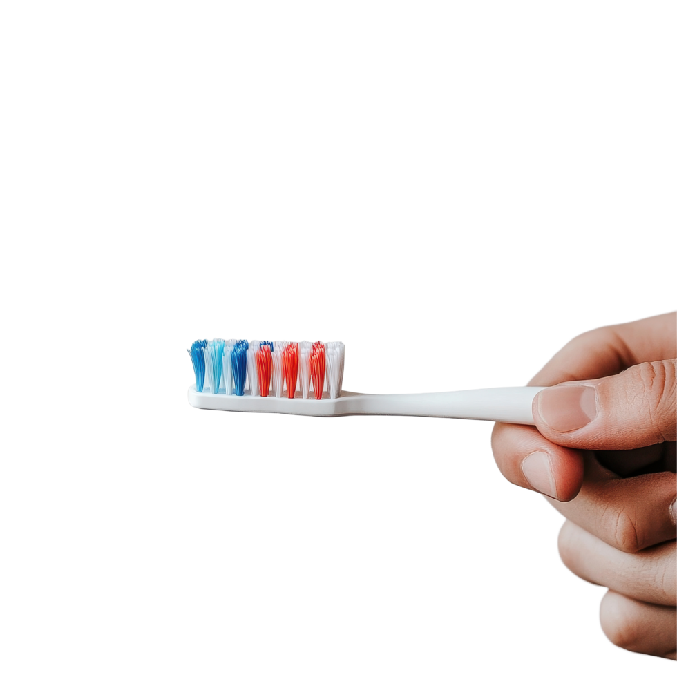 Person holds a toothbrush with colorful bristles and toothpaste in modern bathroom setting, person holding a toothbrush with toothpaste on it, Transparent background png