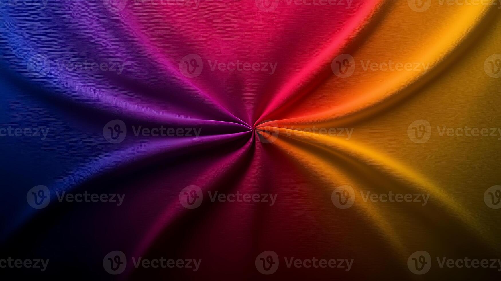 Vibrant swirl of colorful fabric showcasing a dynamic blend of purple, pink, and yellow hues photo