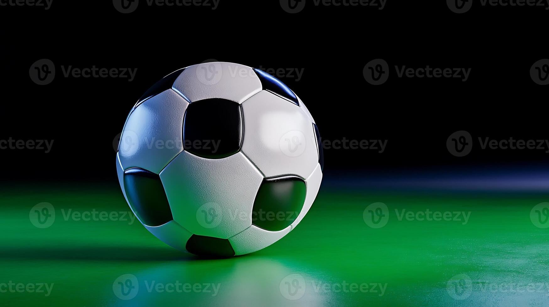 A close-up view of a classic black and white soccer ball resting on a vibrant green surface with dramatic lighting photo