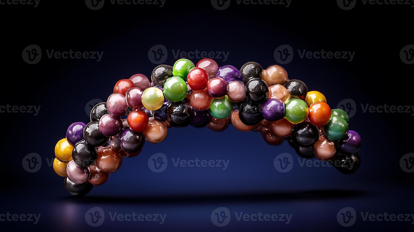 Colorful arrangement of spherical objects forming an arch against a dark background photo