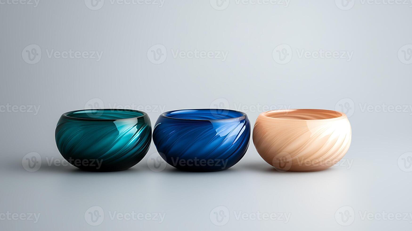 Three elegantly crafted bowls in varying colors arranged on a soft gradient background photo