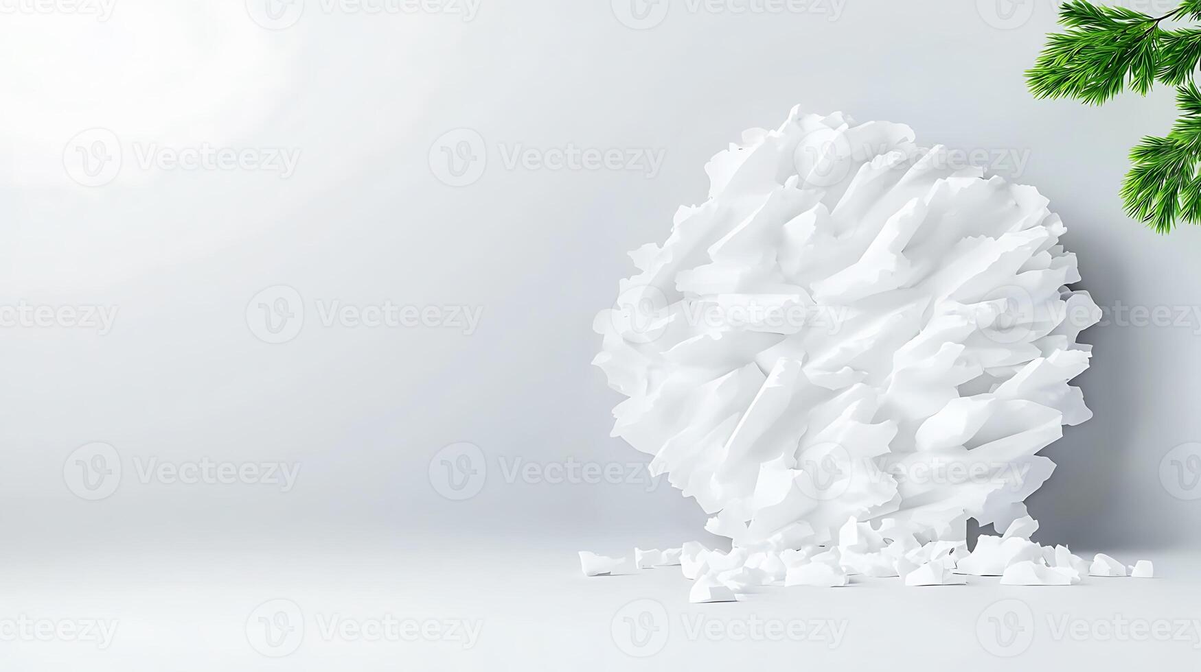 Crumpled white paper ball resting on a minimalist surface with a green pine branch nearby photo