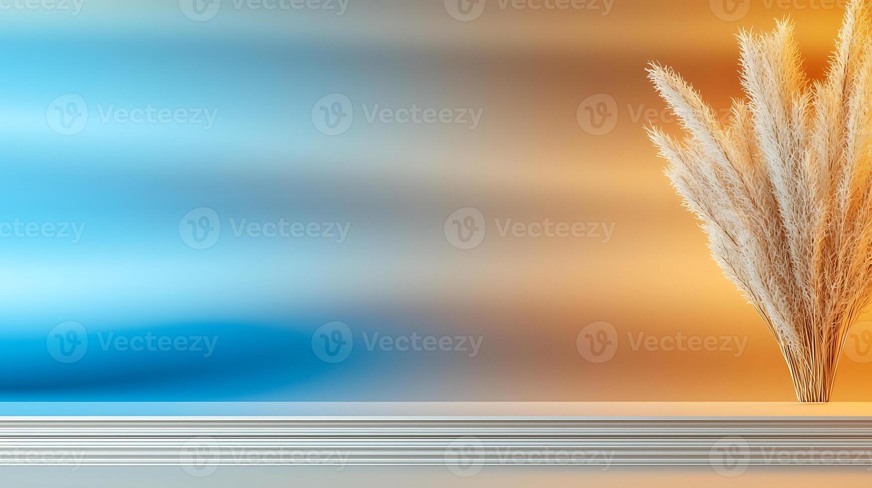 Elegant display of pampas grass against a gradient blue and orange background, creating a serene atmosphere photo