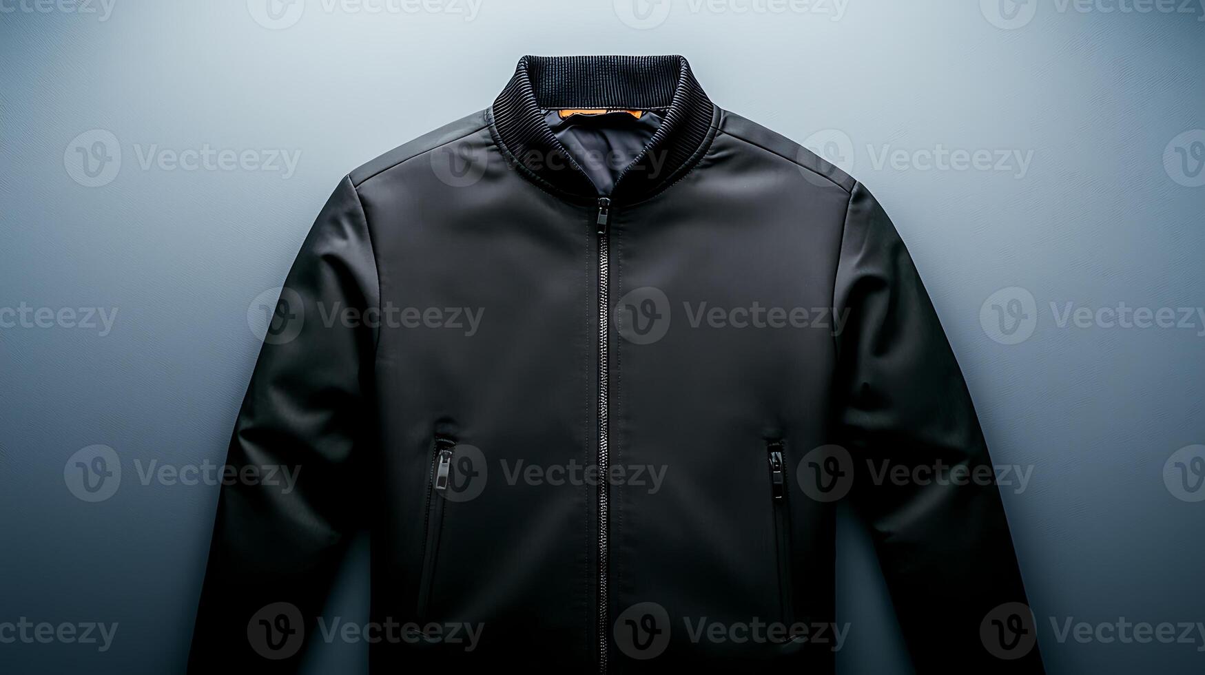 Sleek black bomber jacket displayed on a minimalist background, emphasizing modern fashion design photo