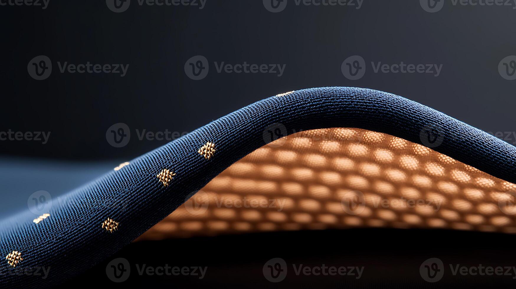Close-up of a textured fabric showcasing intricate patterns and a soft, illuminated underside photo