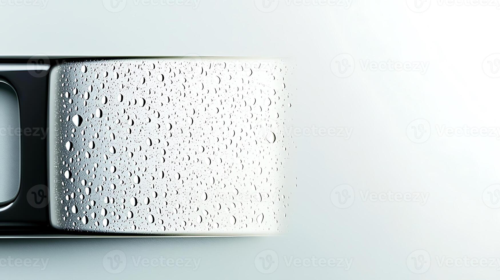 Close-up of a sleek metallic surface with water droplets, showcasing modern design and freshness photo