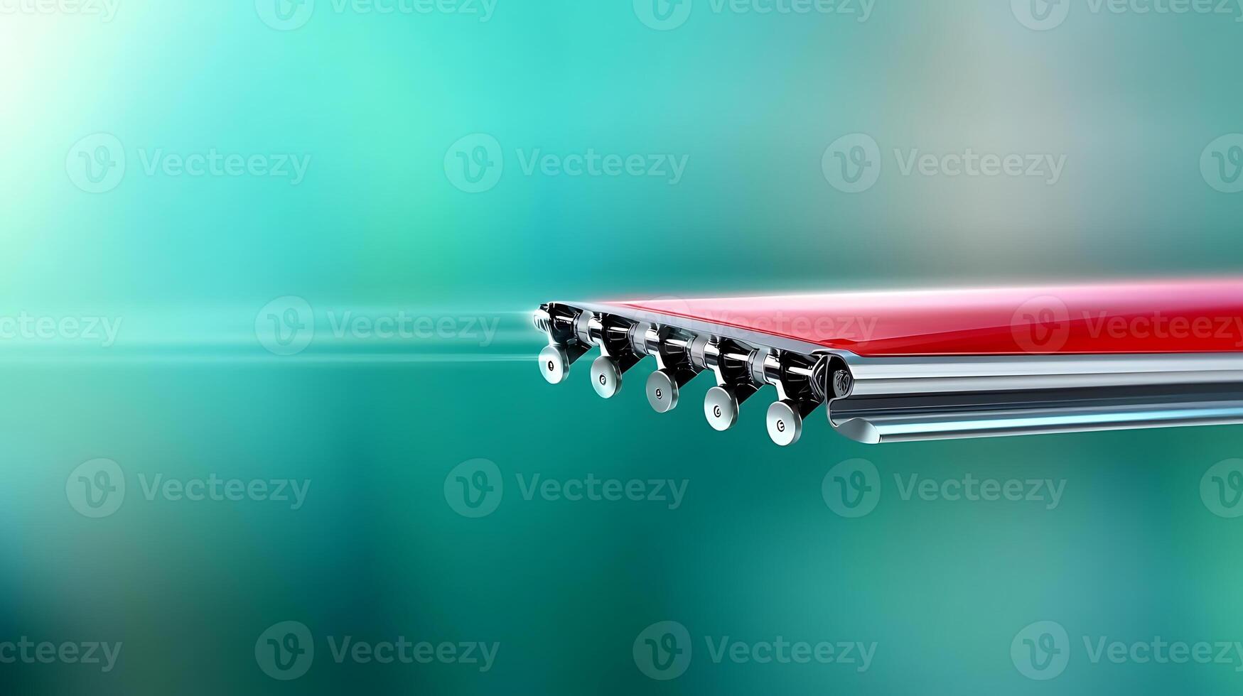 Close-up of a sleek red object with wheels, set against a blurred teal background, suggesting speed photo