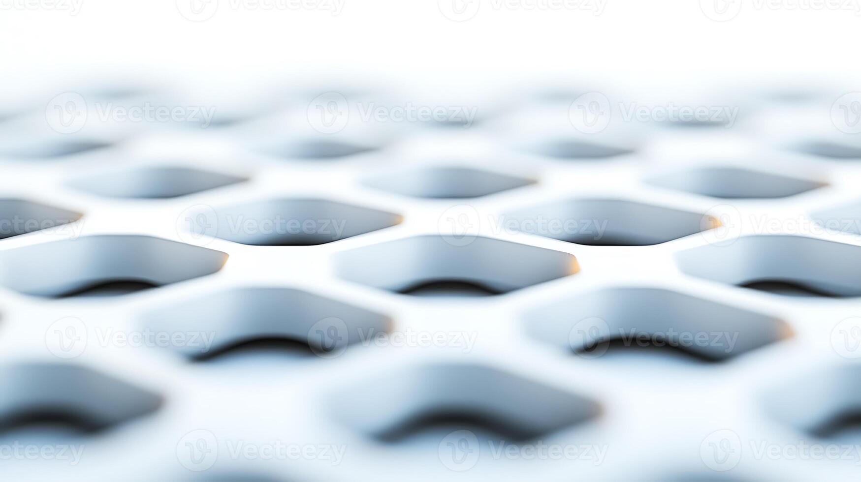 Close-up view of a textured hexagonal pattern on a metallic surface with soft lighting photo