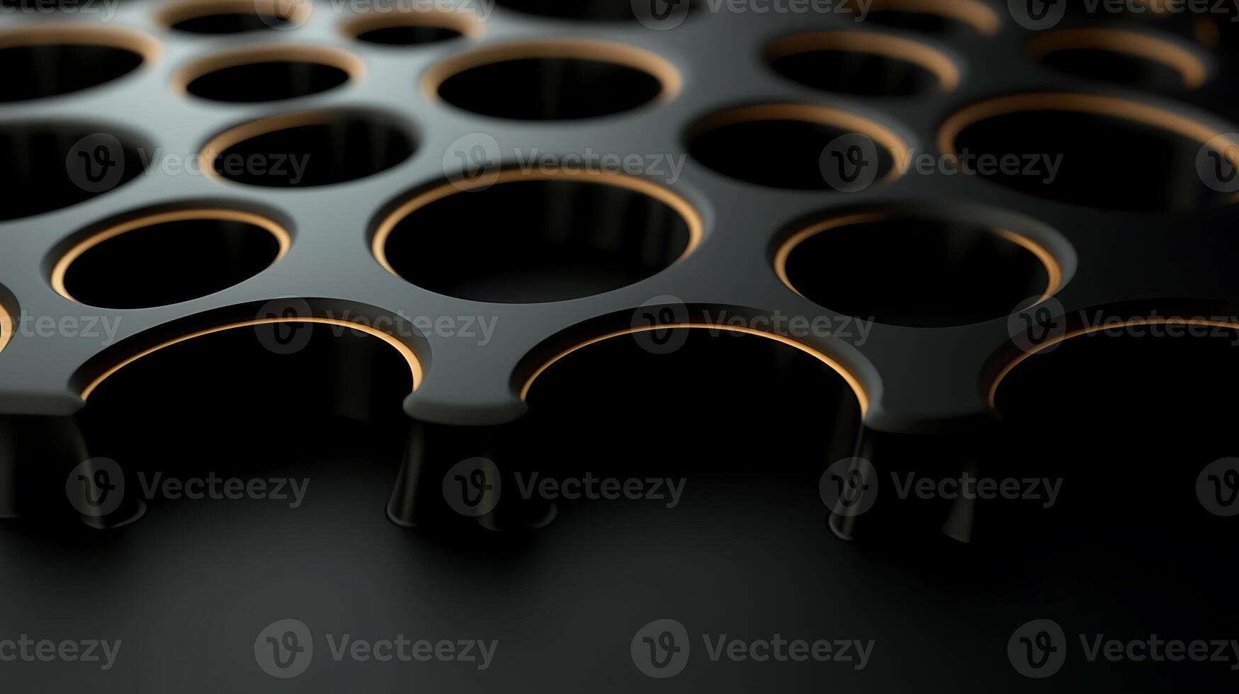 Close-up view of a textured black surface with circular cutouts and glowing edges, showcasing design photo