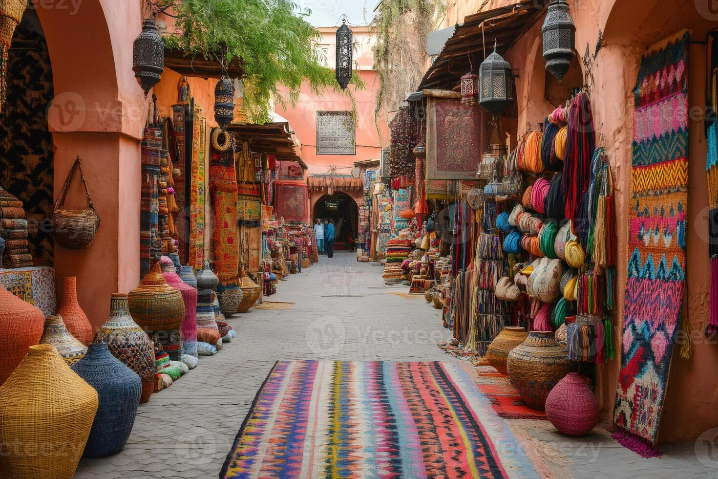 Colorful carpets and souvenirs decorating the stalls of a moroccan souk in marrakesh photo