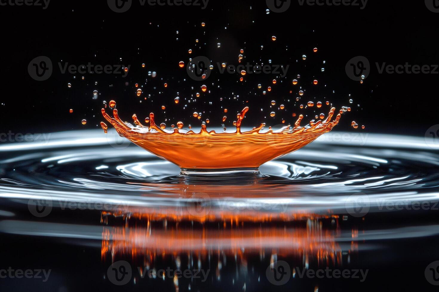 Orange liquid splashing and making a crown on dark background photo