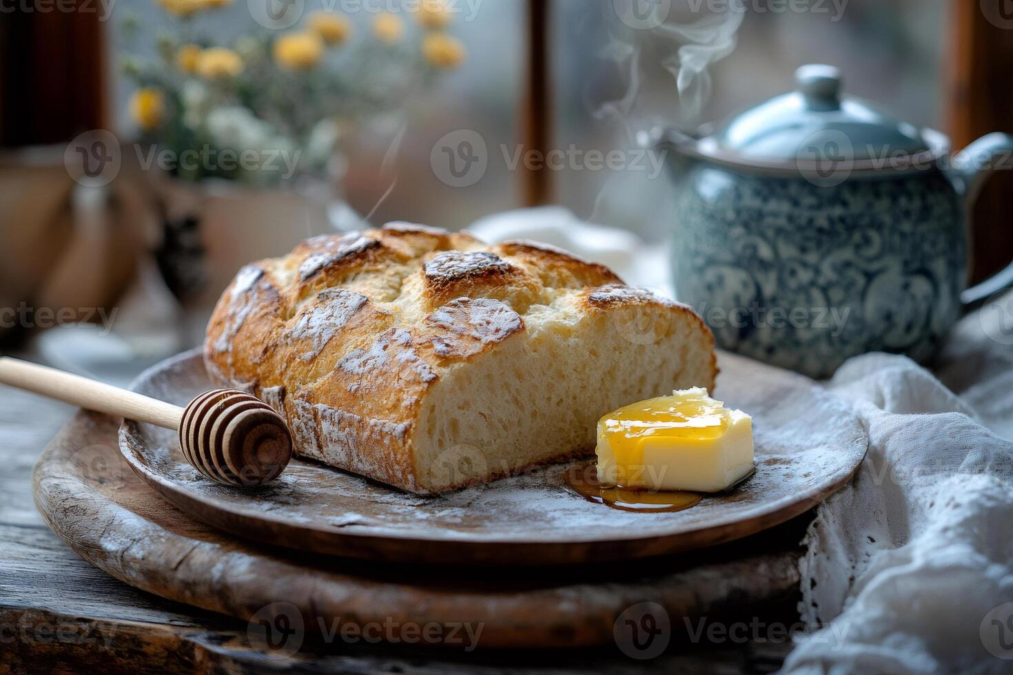 Steaming loaf of bread with honey and butter on wooden plate photo