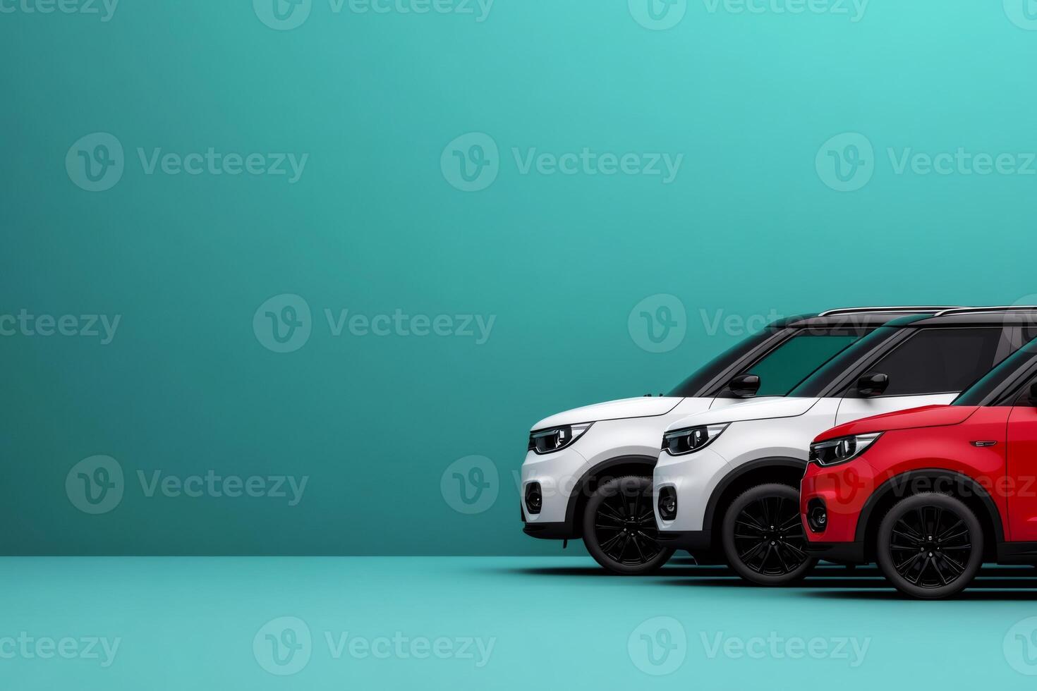 Three modern compact suvs parked in front of teal wall photo