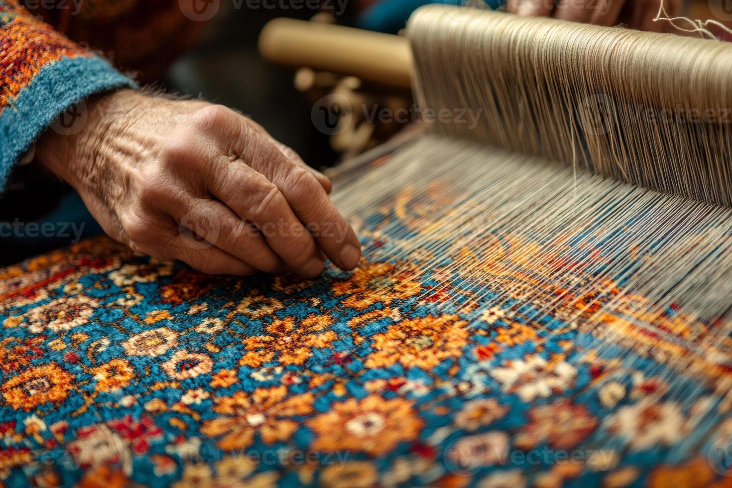 Craftsman weaving traditional persian carpet on a loom .. photo