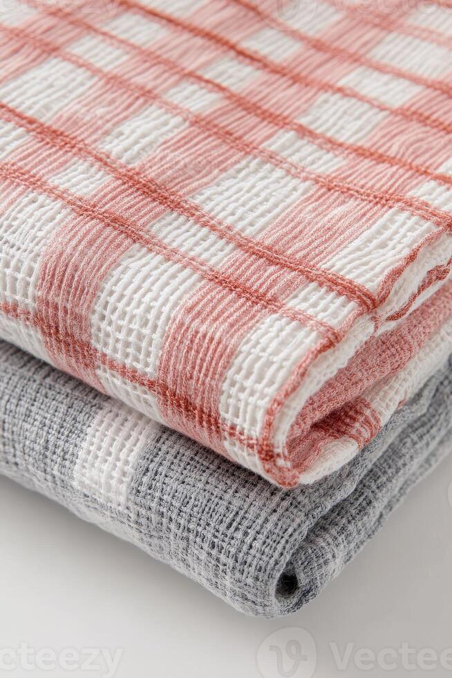 Linen fabric towels in red and gray colors stacked neatly photo