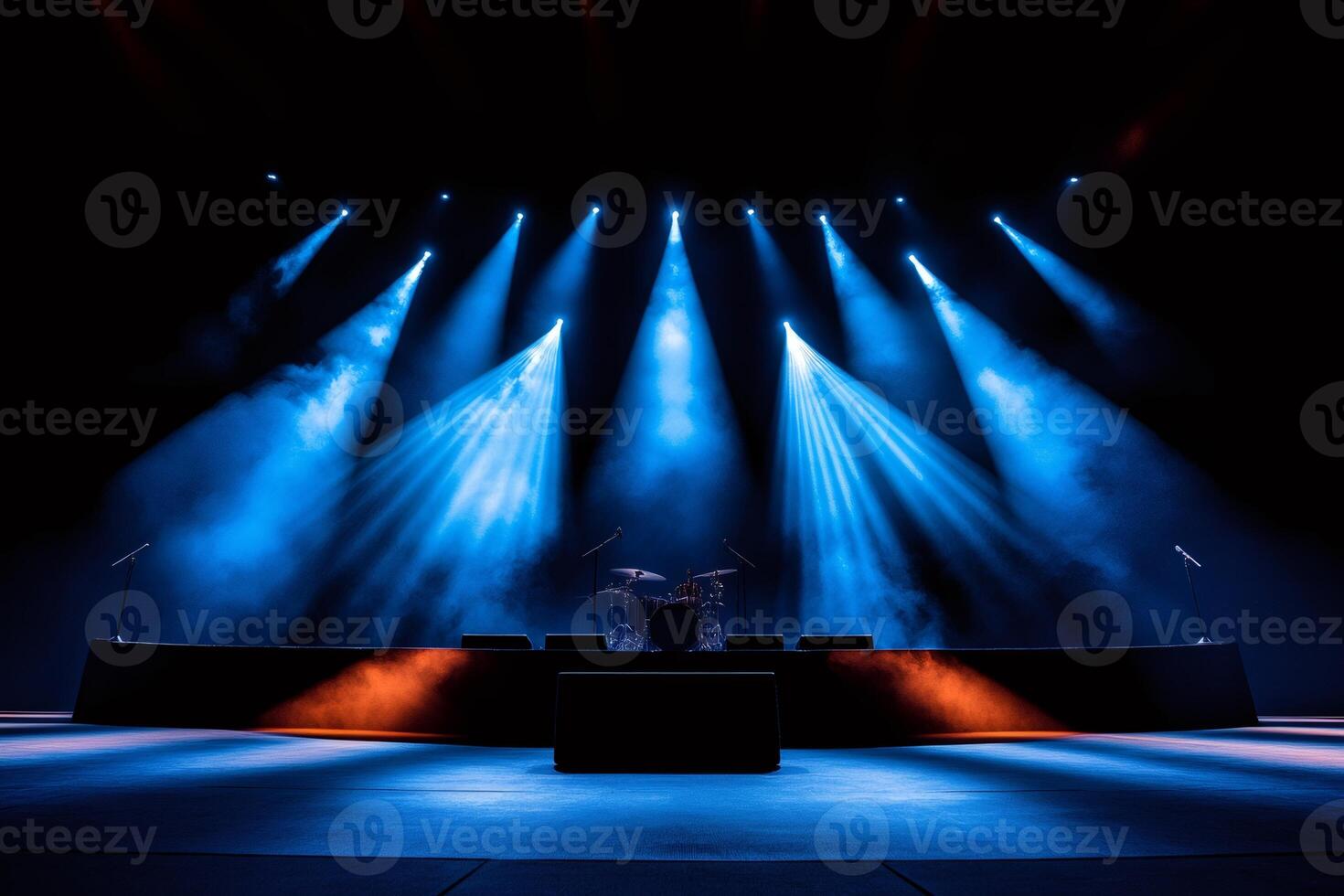 Empty stage illuminated by blue spotlights awaiting the show photo