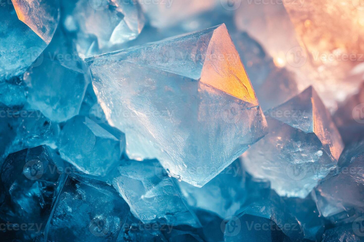 Macro close up of sparkling light blue and orange crystals reflecting light photo