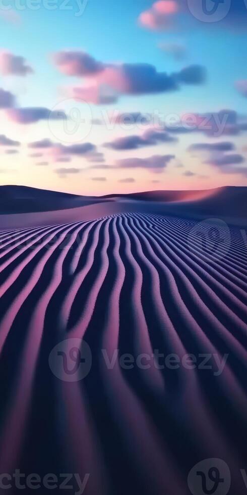 A desert with ripples and clouds in the sky photo