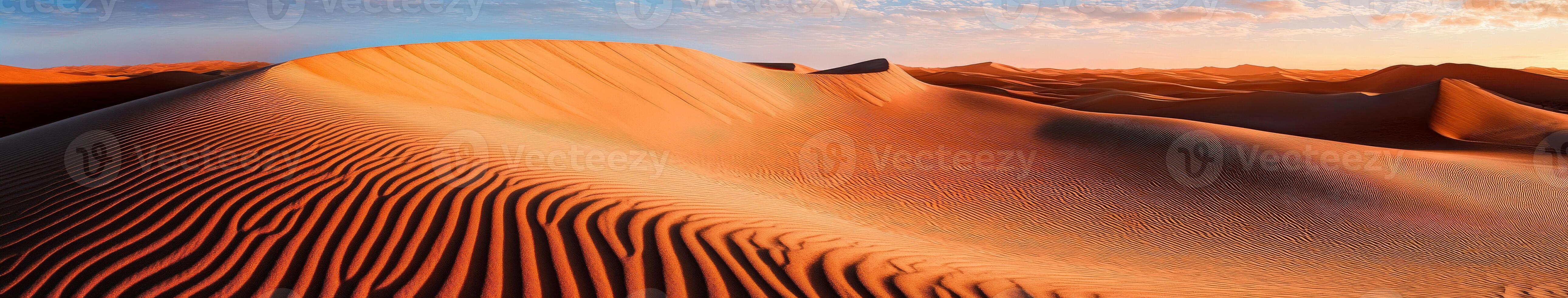 The desert at sunset with sand dunes and mountains photo