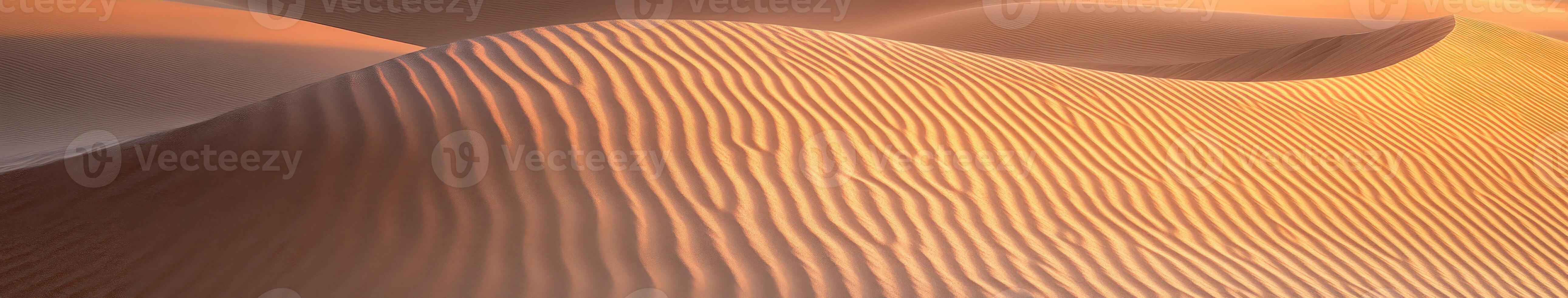 A desert with sand dunes and waves photo