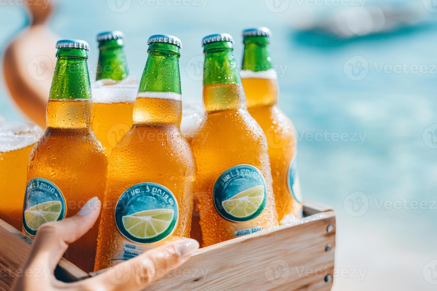 Waiter carrying wooden crate with cold beer bottles at beach bar photo