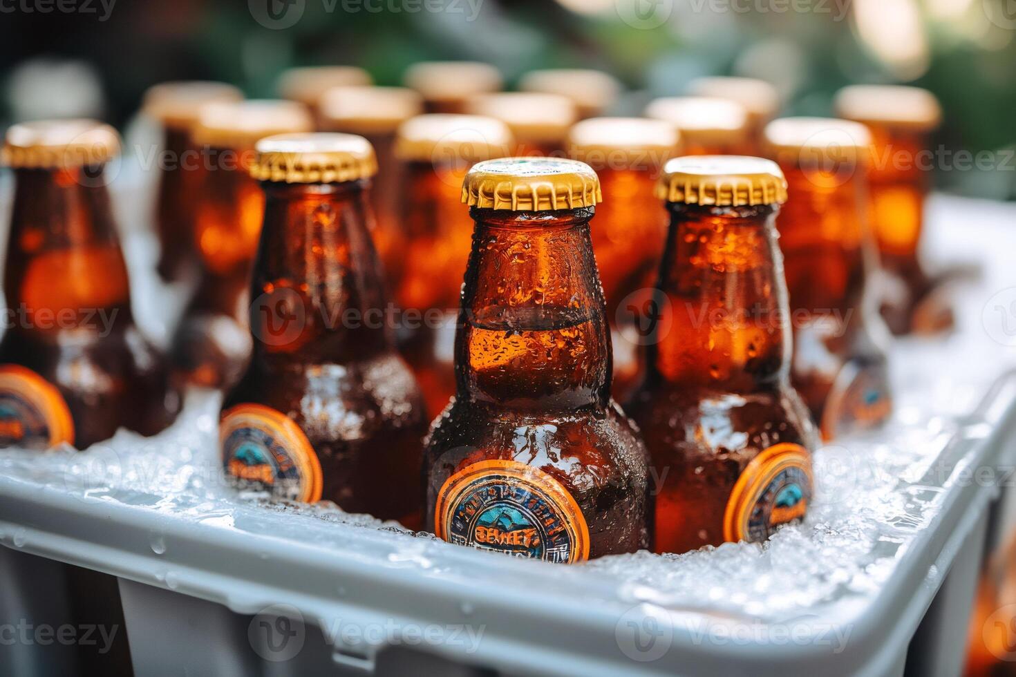 Ice cold beer bottles chilling in cooler for refreshing summer party photo