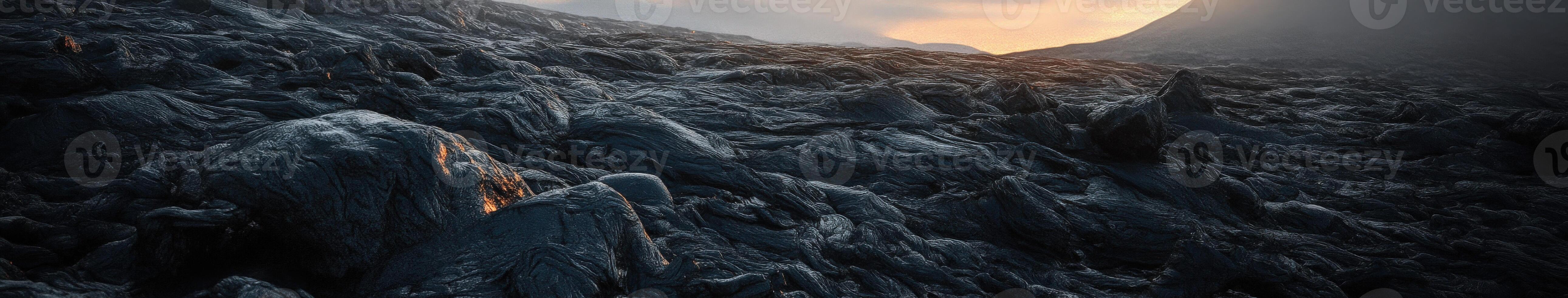 A mountain with rocks and a sun setting behind it photo