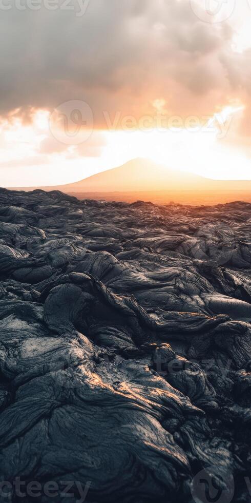 A lava field with the sun setting over it photo
